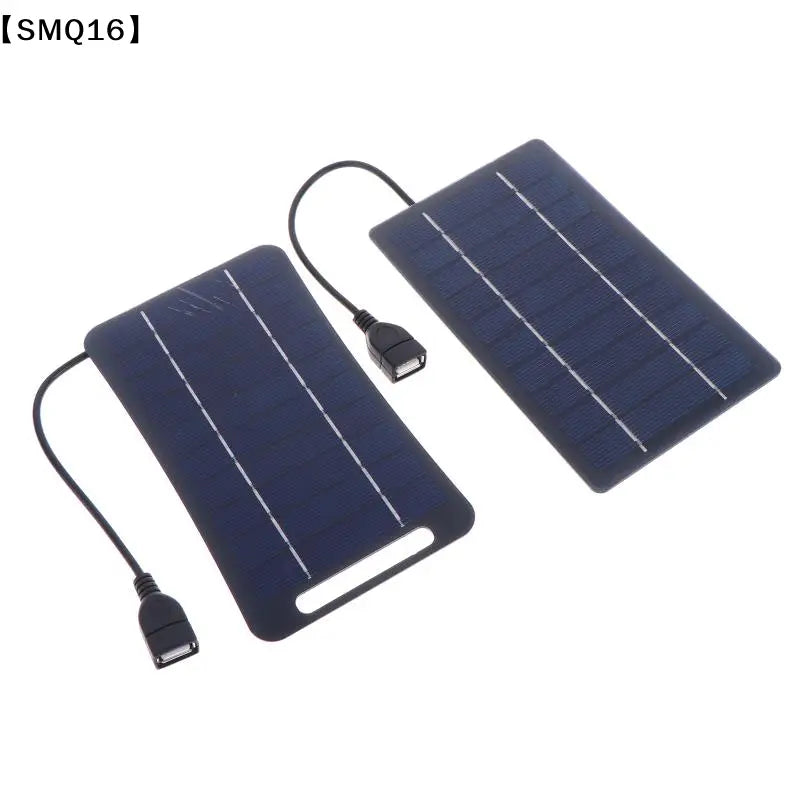 two dark blue rectangular solar panels with black usb cables and connectors designed as a portable solar charging panel to stay connected on the go