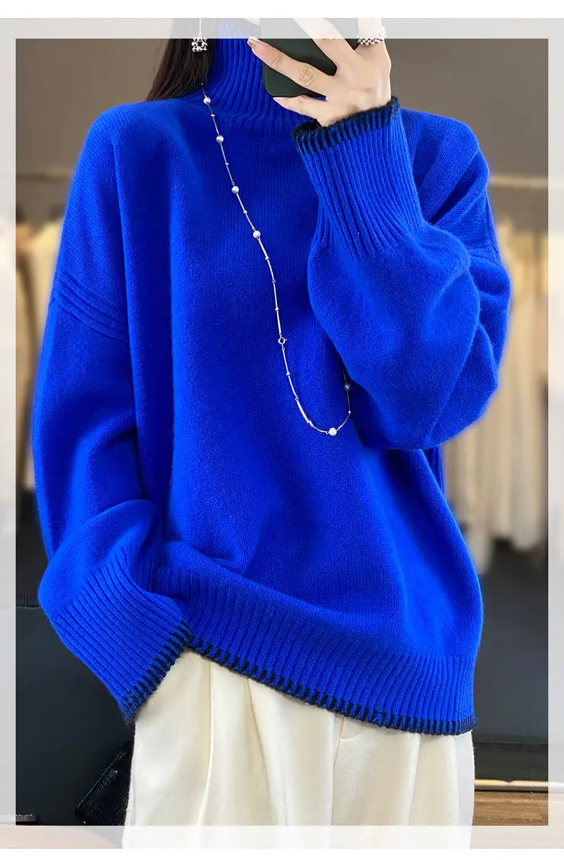 Vibrant royal blue pure wool oversized turtleneck sweater for women with ribbed cuffs and hem.