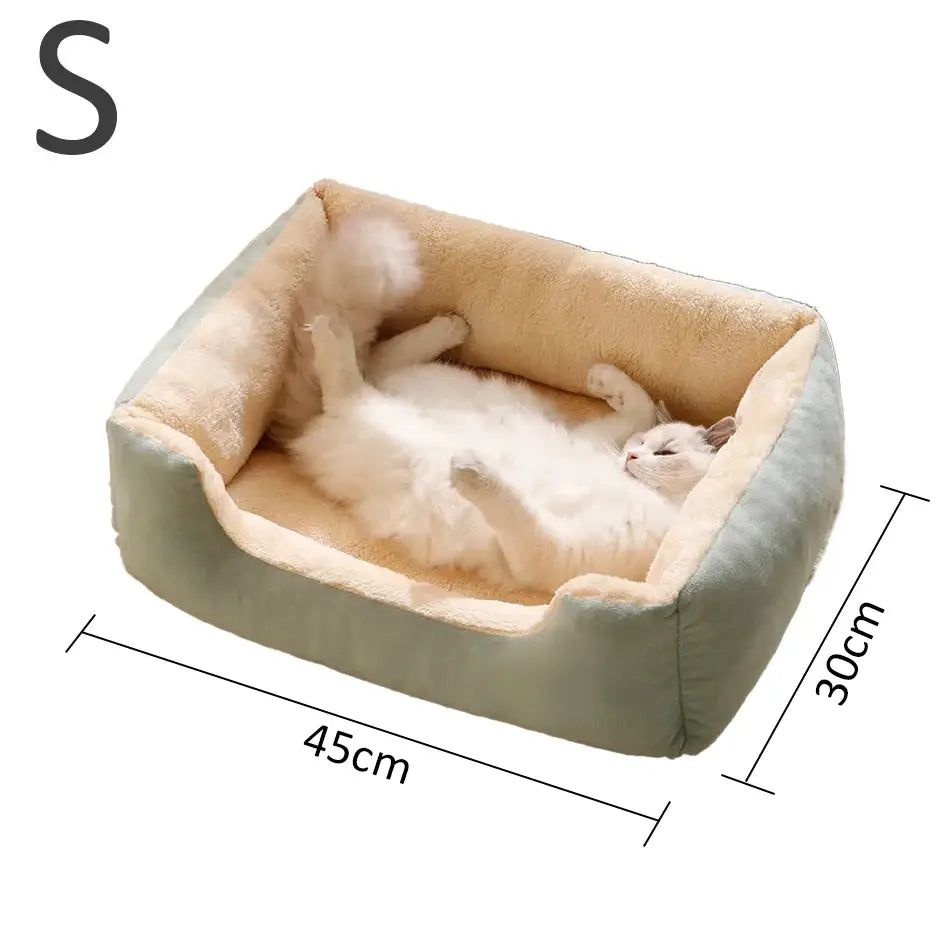 Plush rectangular cat bed with soft sage green exterior and plush beige interior lining for comfortable pet cushioning.