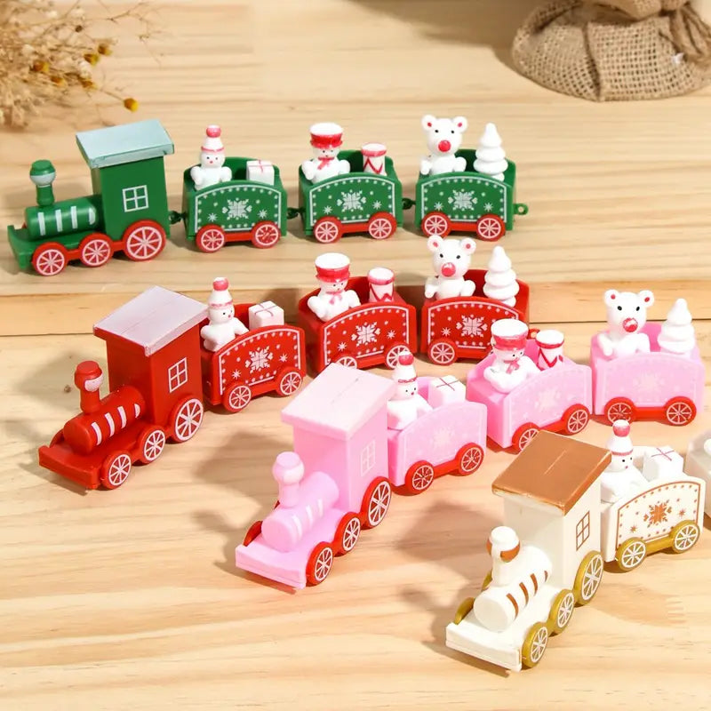 Wooden Christmas train toy holiday home decoration in green red pink and white featuring snowmen and bears on board.