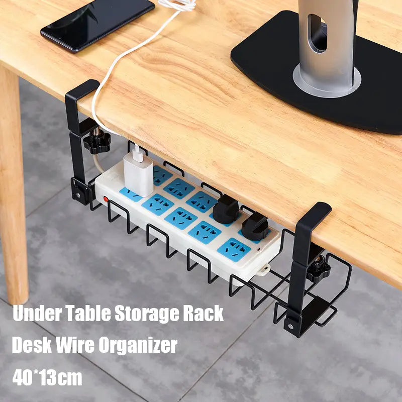 Black metal under-table storage rack holding a white power strip with blue outlets for under desk cable management and wire organization.