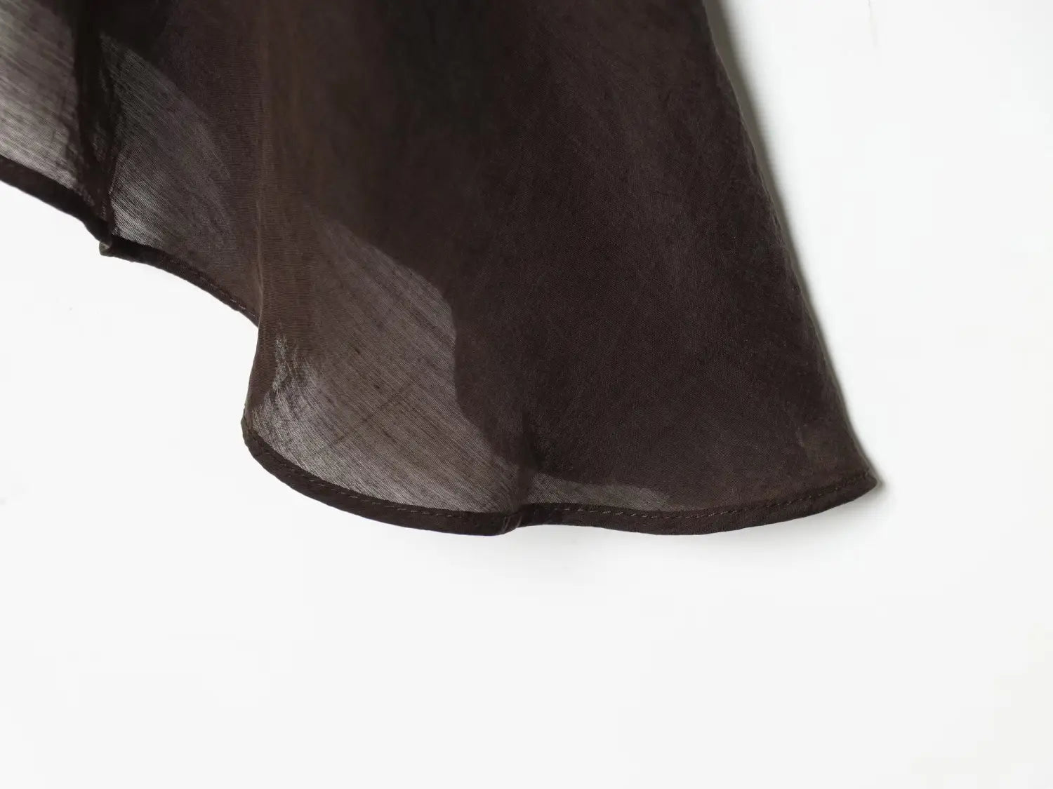 Brown chiffon flare sleeve blouse featuring a flowing dark brown sheer fabric with subtle texture and a neatly stitched hem showcasing the sleeve style.