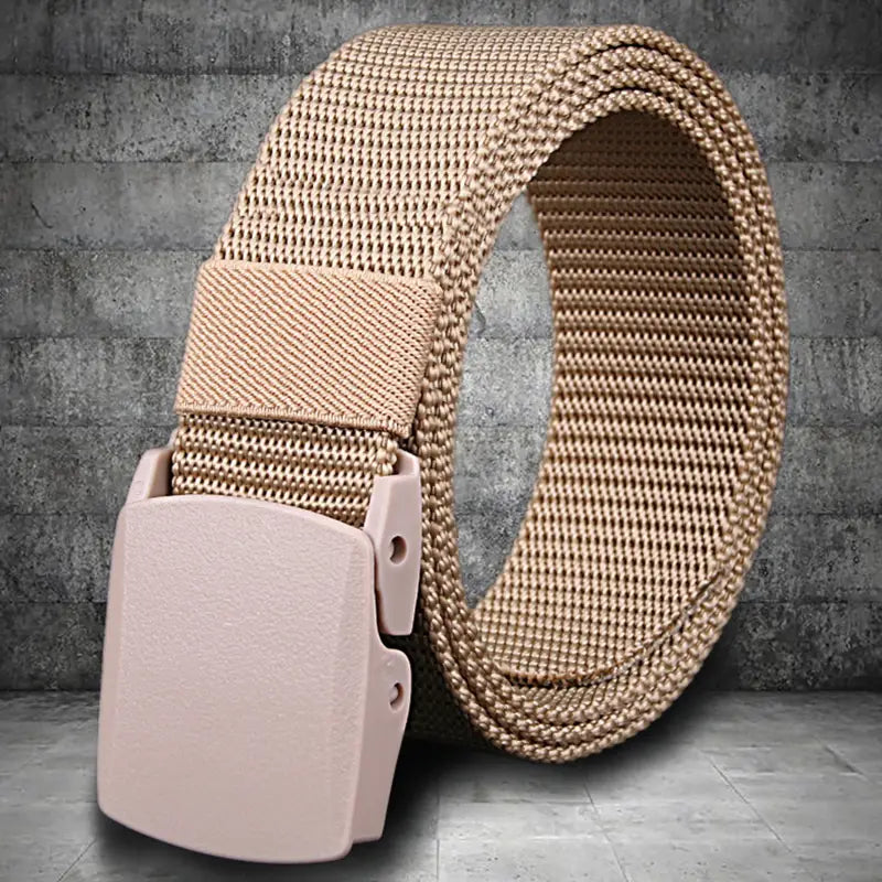 Mens tactical canvas belt in tan mesh with a lightweight automatic matte pink plastic buckle.