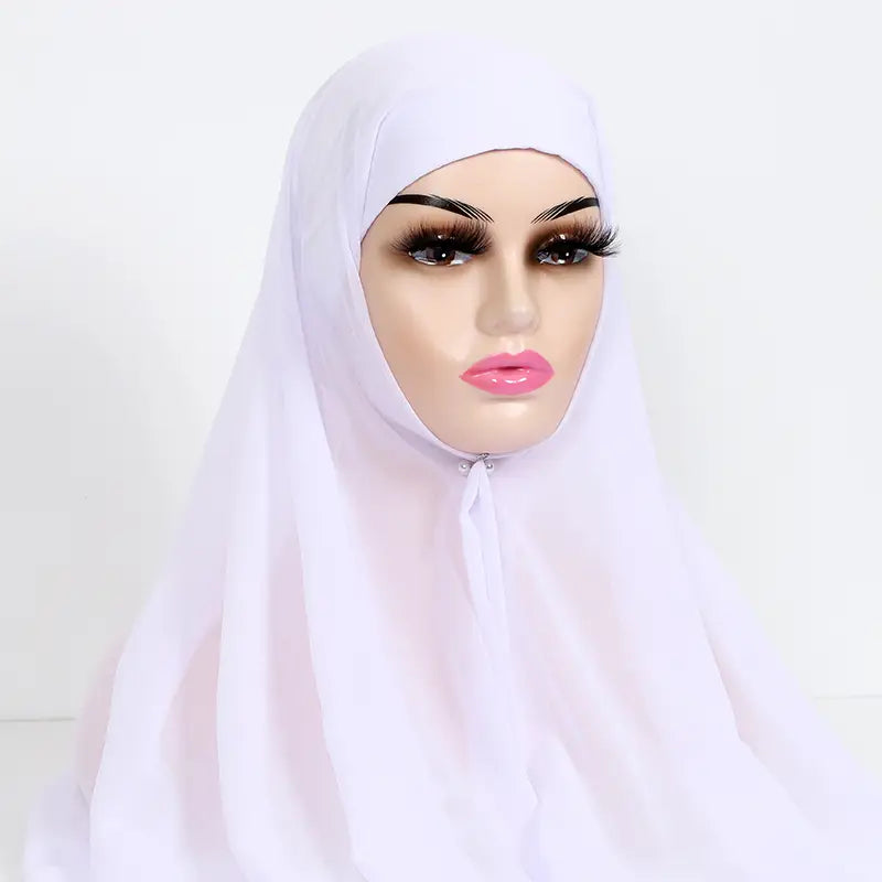 A soft flowing white instant chiffon hijab with cap bonnet made of lightweight fabric drapes elegantly over a mannequin head.