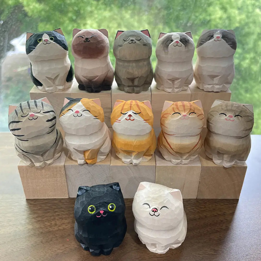 a collection of factory direct handcrafted wooden cat figurine desk decor featuring intricately carved designs with unique color patterns and charming facial expressions