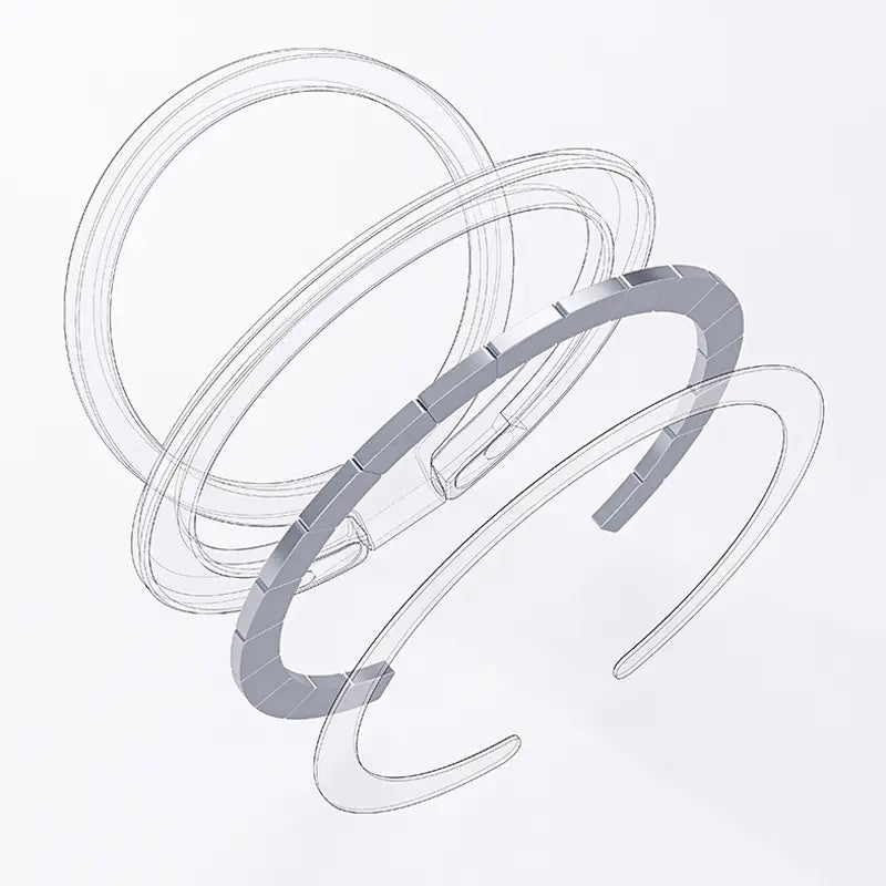 Pulsera tipo brazalete segmentada con acabado plateado y tono metálico, con un diseño moderno y elegante, mostrada junto con un anillo soporte magnético para teléfono MagSafe.