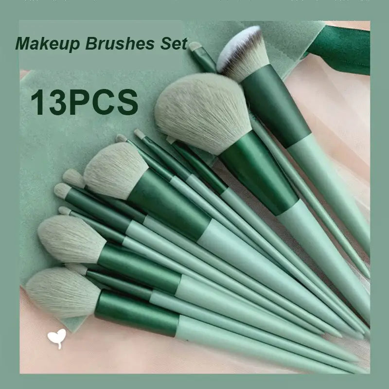 A set of 13 makeup brushes with sleek green and mint-colored handles and soft fluffy bristles designed for eye shadow and cosmetic brush applications.