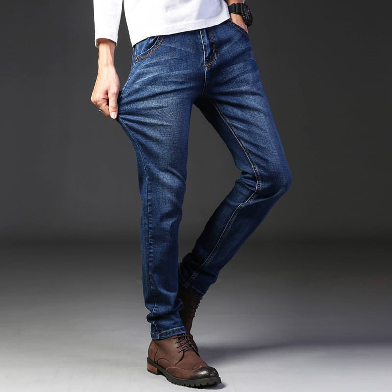 Dark blue stretch denim jeans for men with a slim fit and classic stitching ideal for casual wear.