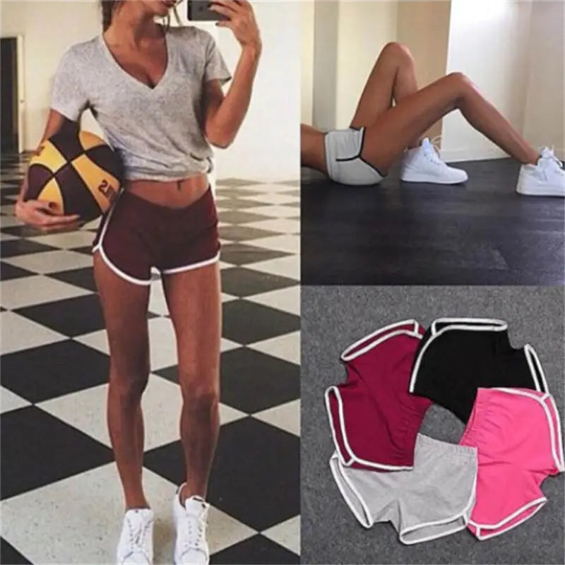 Maroon sports shorts women with white trim featuring an elastic waist for casual athletic use.
