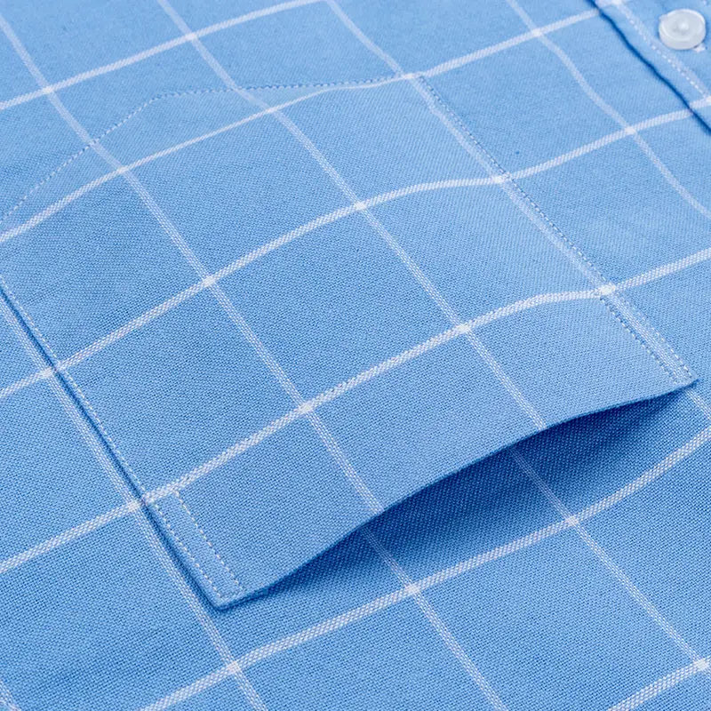 Men’s cotton oxford slim fit plaid shirt in light blue with a crisp white grid pattern and a neatly stitched pocket.