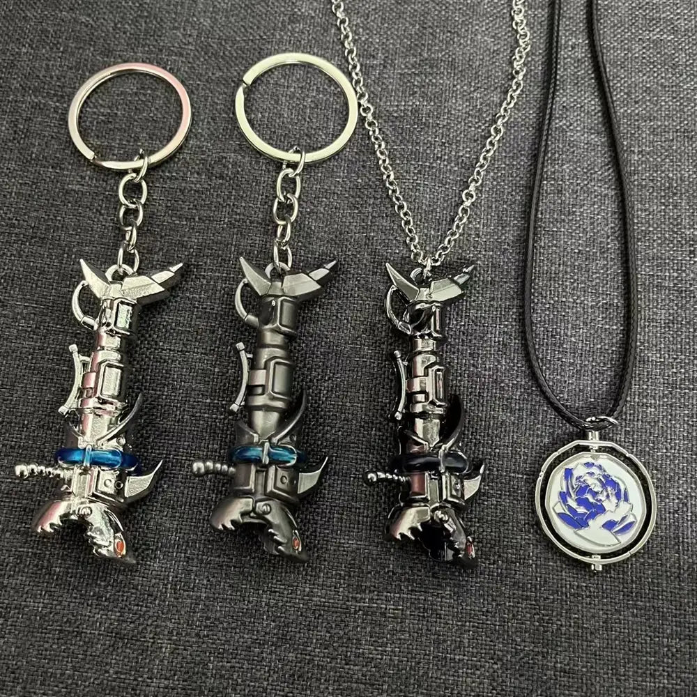 Three metallic keychains and one pendant featuring detailed miniature Jinx Cannon anime weapon designs with blue accents for gaming accessory use.
