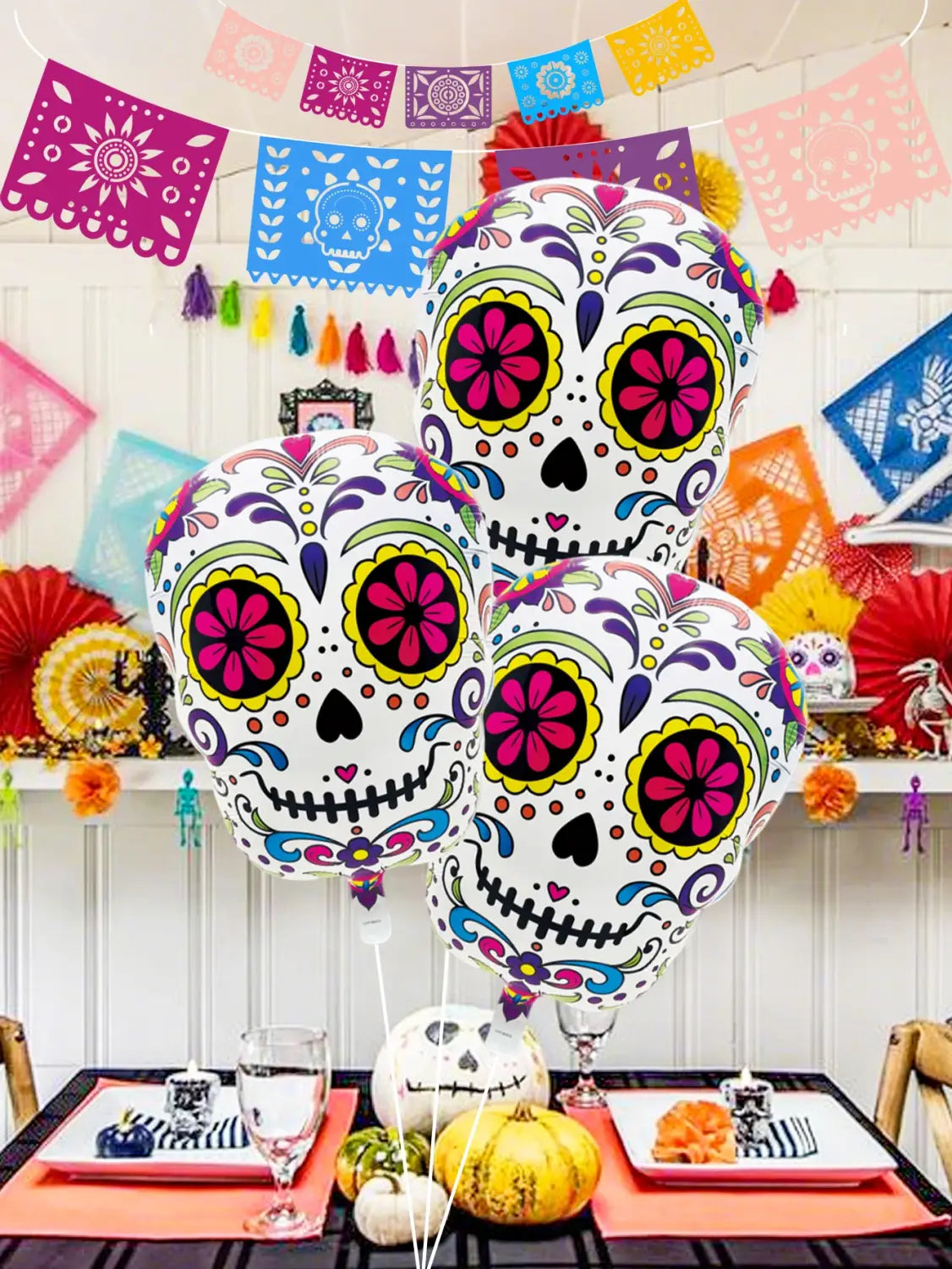 colorful flower skull foil balloons 3 pack featuring vibrant pink and yellow floral patterns on intricately designed sugar skulls against a white background
