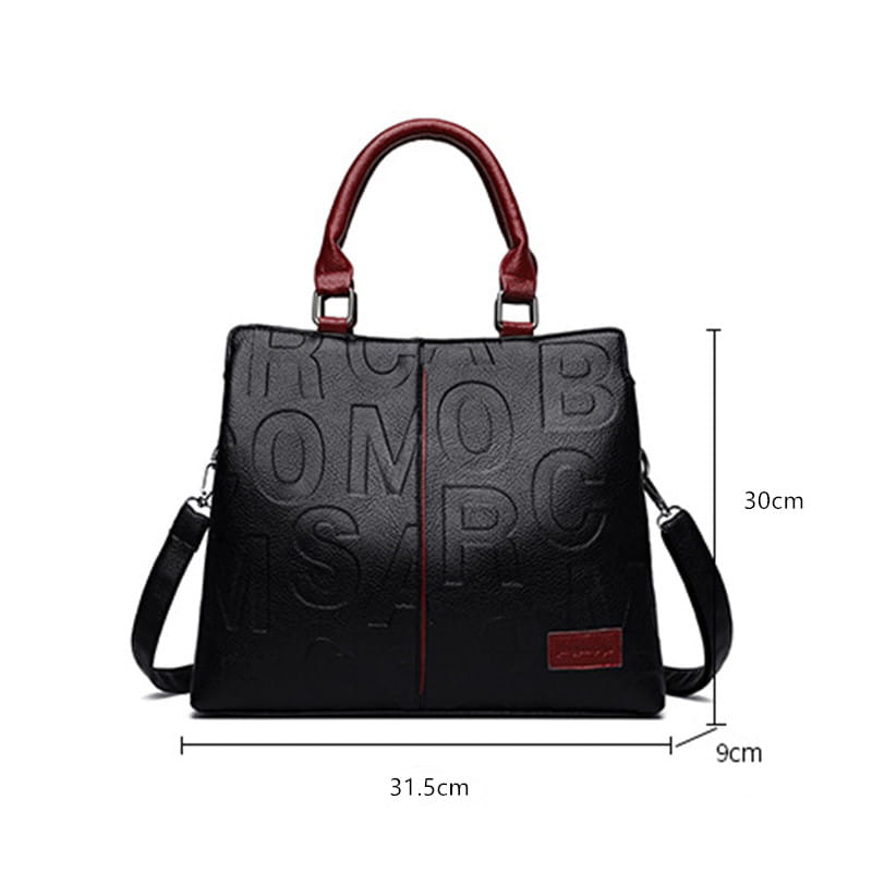 black crossbody handbag style1 style2 made of pu leather featuring embossed lettering with red handles and a matching red strap accent