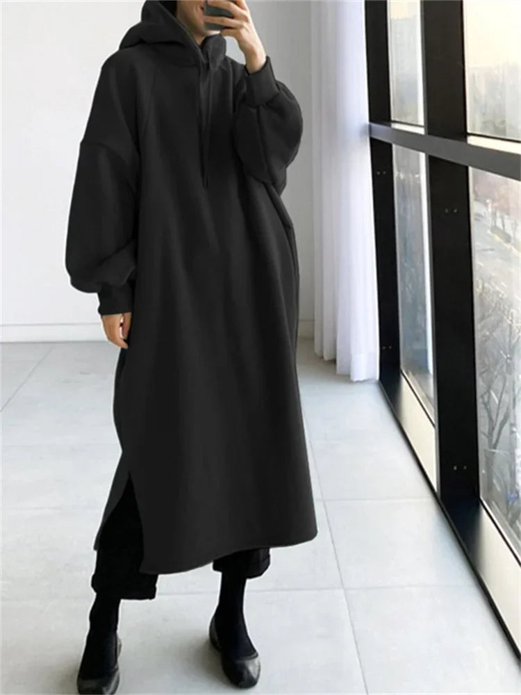 black fleece lined oversized hoodie dress with long sleeves and front slit for casual wear