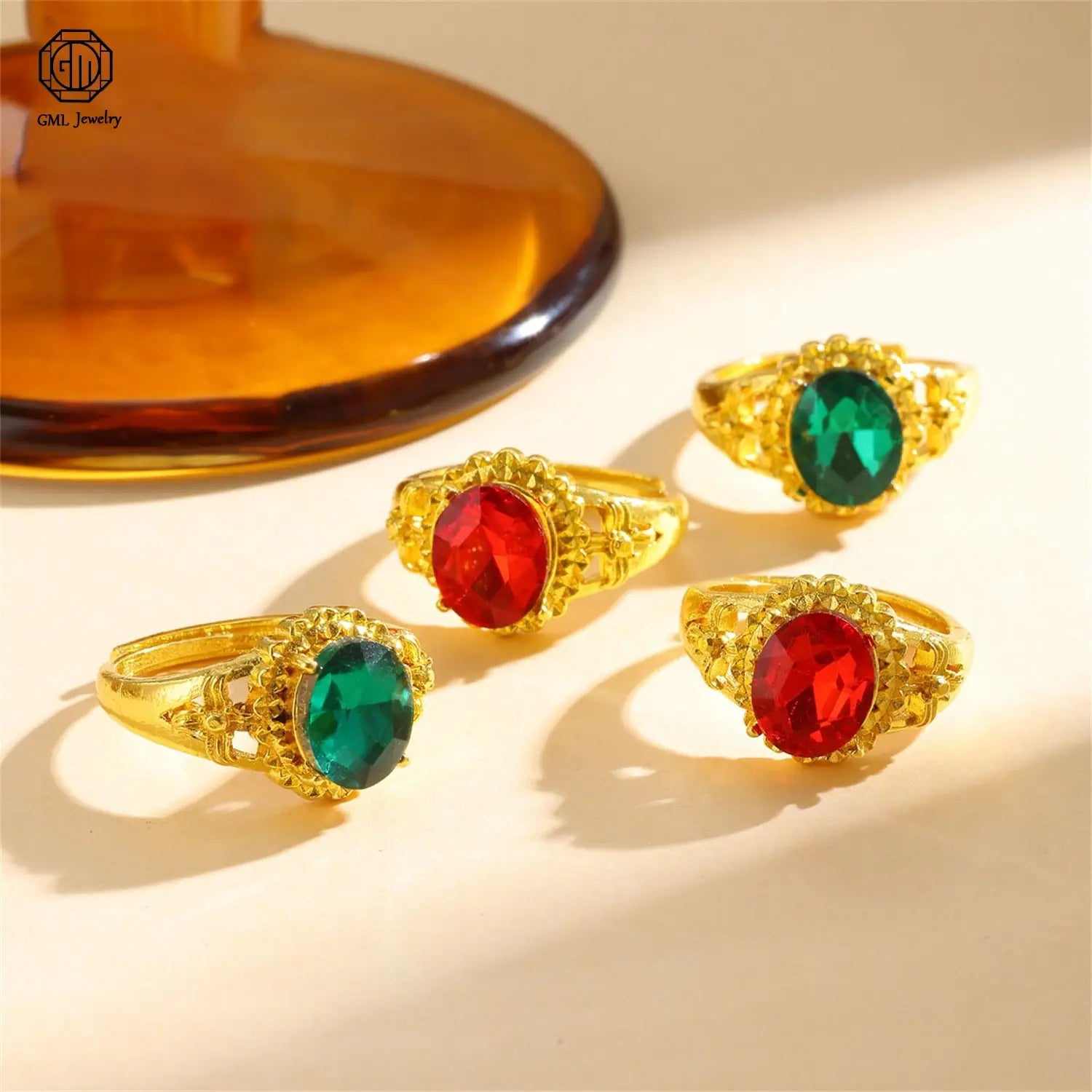 sand gold adjustable gold-toned rings with intricate filigree designs and prominent oval-cut red or green gemstones featuring a fade resistant matte wide band suitable as a unisex gold adjustable ring.