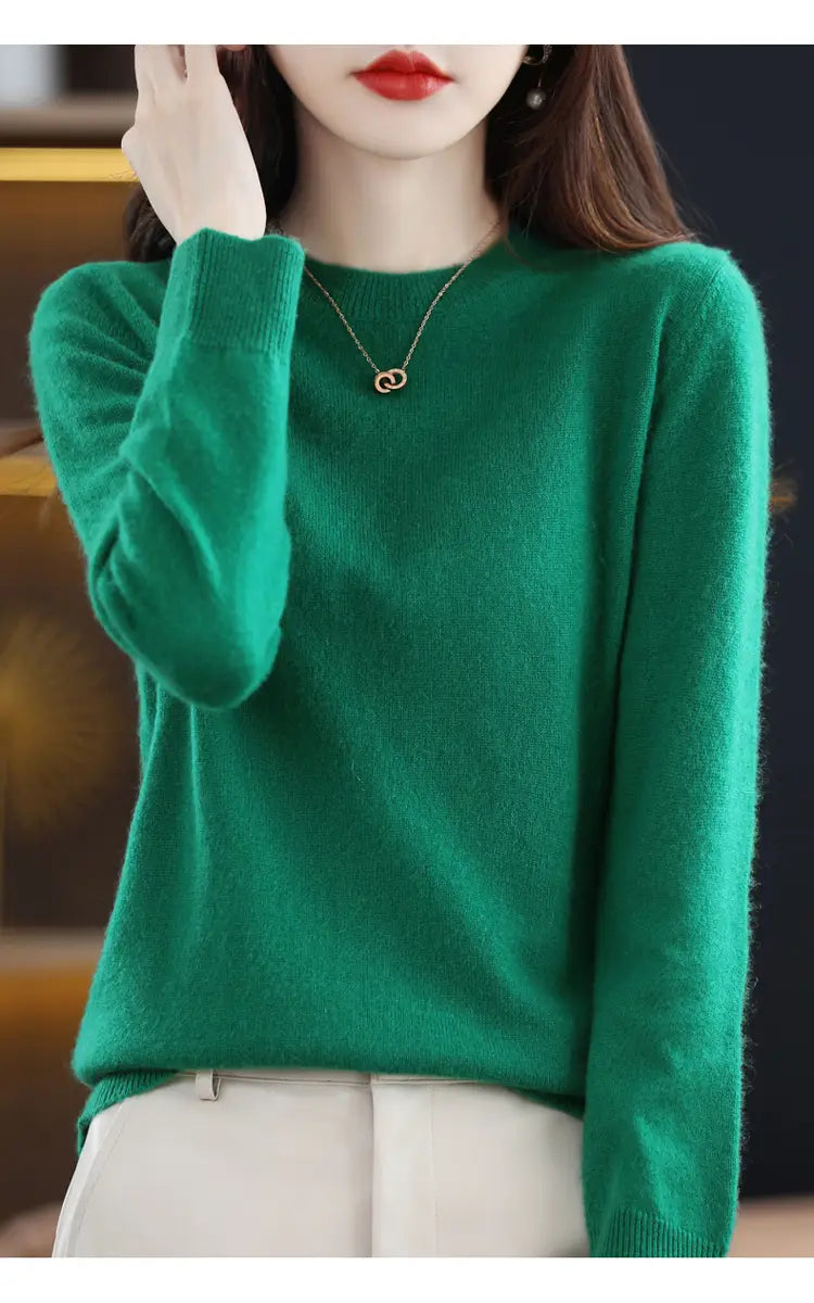 A soft vibrant green pure wool cashmere O-neck pullover sweater with long sleeves and a round neckline.