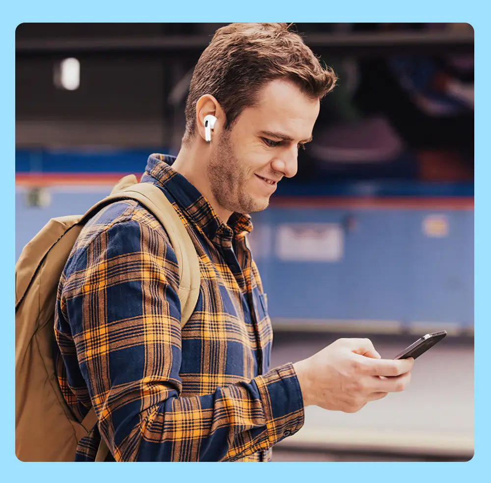 a man wearing white true wireless bluetooth earphones in his right ear featuring hifi sound and noise reduction capabilities