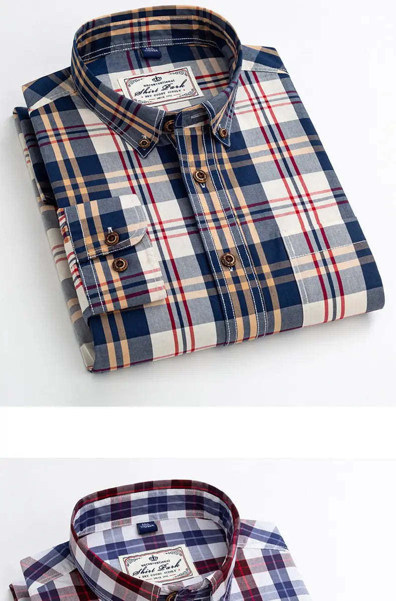 A neatly folded men’s cotton plaid long sleeve slim fit shirt in navy beige and red tones with a classic collar and matching buttons.