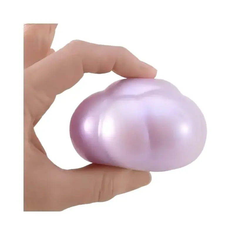 A soft lavender-colored pearlescent needoh cloud pleaser slow rising squishy toy with a smooth rounded cloud-like shape viewed from the front.
