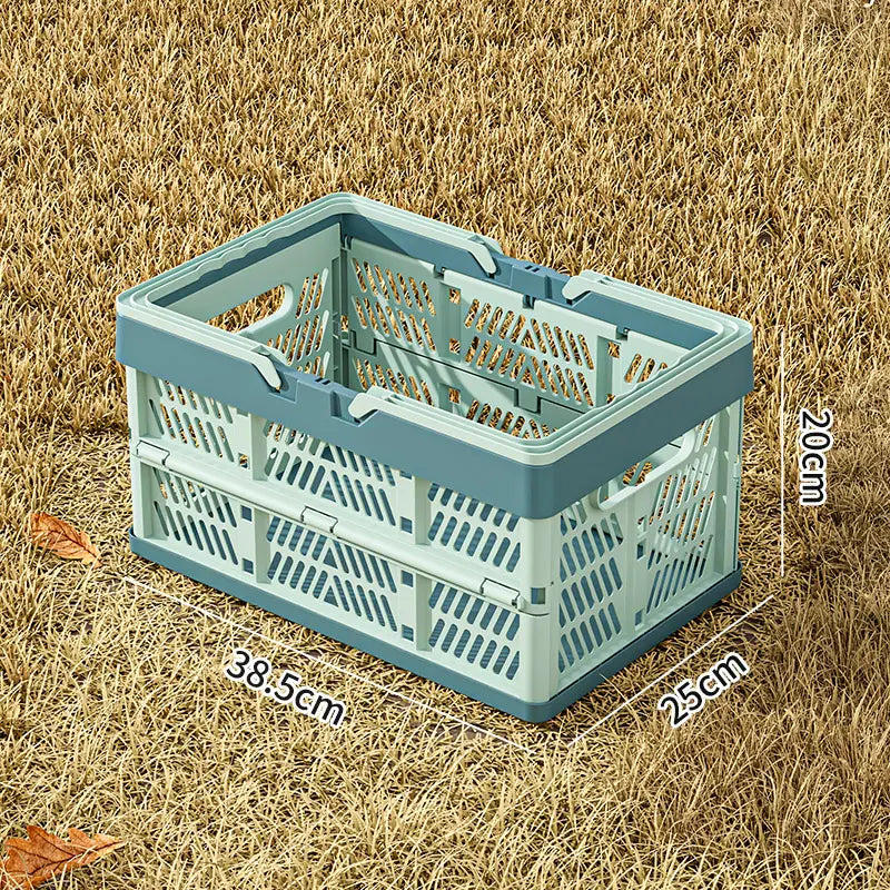 A light blue foldable plastic storage basket with diamond-patterned sides and a sturdy handle designed as a collapsible crate.