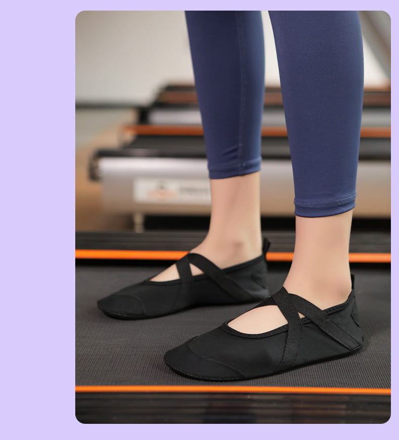 black canvas women yoga shoes with elastic straps and a soft flexible sole designed as anti-slip fitness flats
