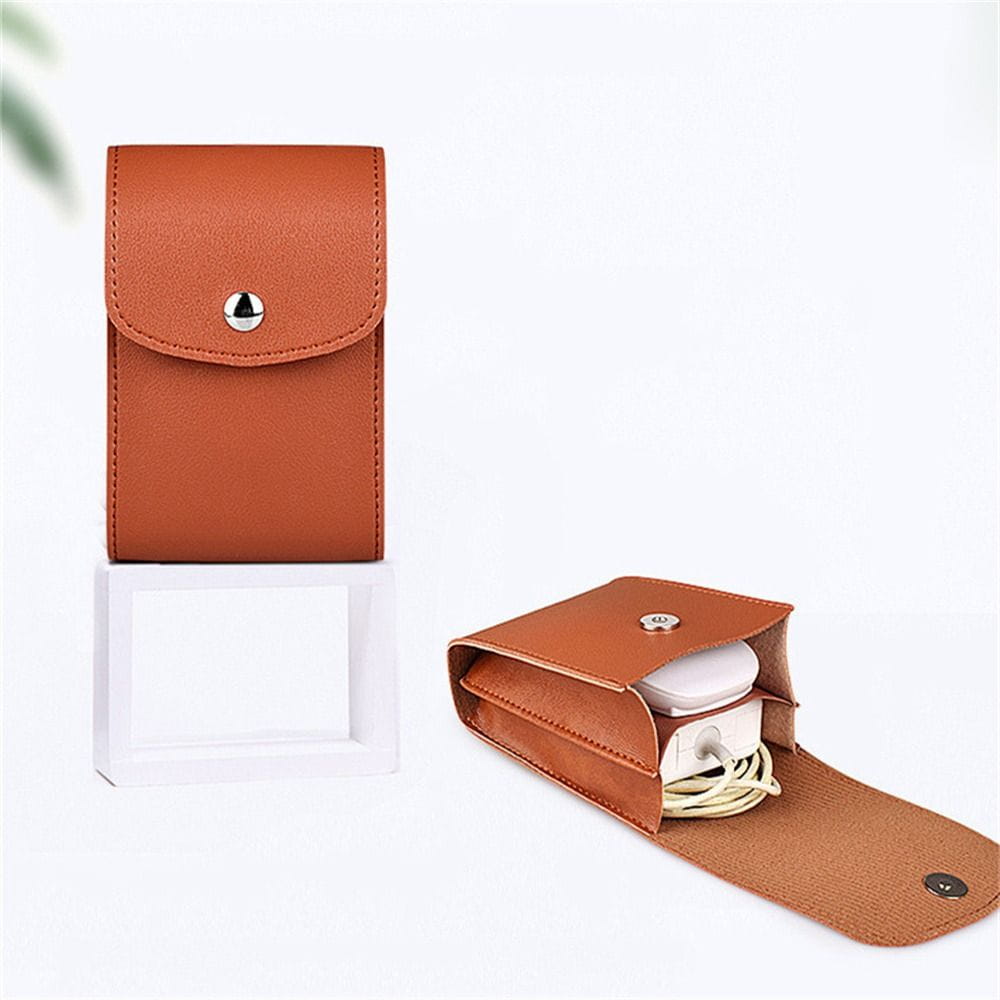 Tan leather digital storage bag with a silver snap button closure designed as a portable cable organizer made from pu leather.