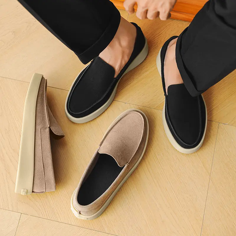 Men casual suede loafers slip on walking shoes in black and beige with a chunky white rubber sole.