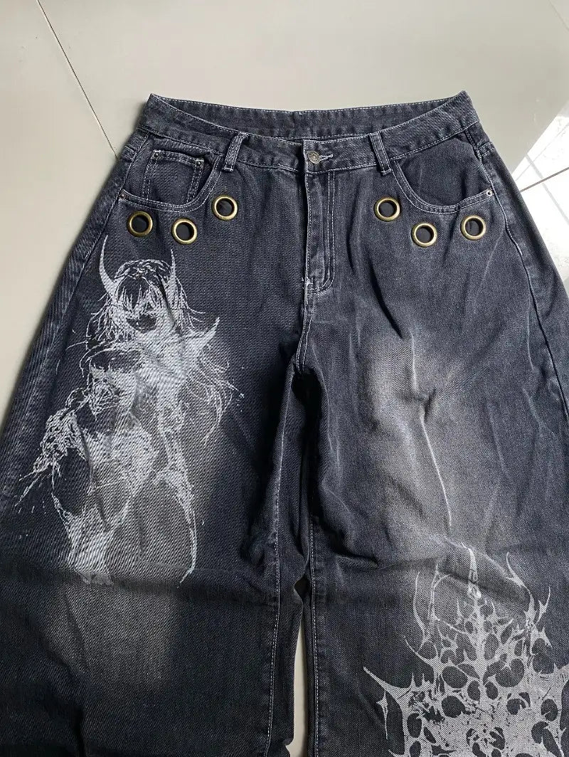 Dark wash denim Y2k gothic graphic wide leg jeans for men featuring a white demonic print and gold toned metal grommets.