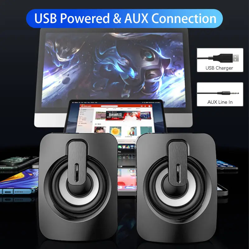 Black USB wired computer speakers with RGB LED lights featuring a sleek rectangular design and circular drivers with USB power and aux connection for desktop use.