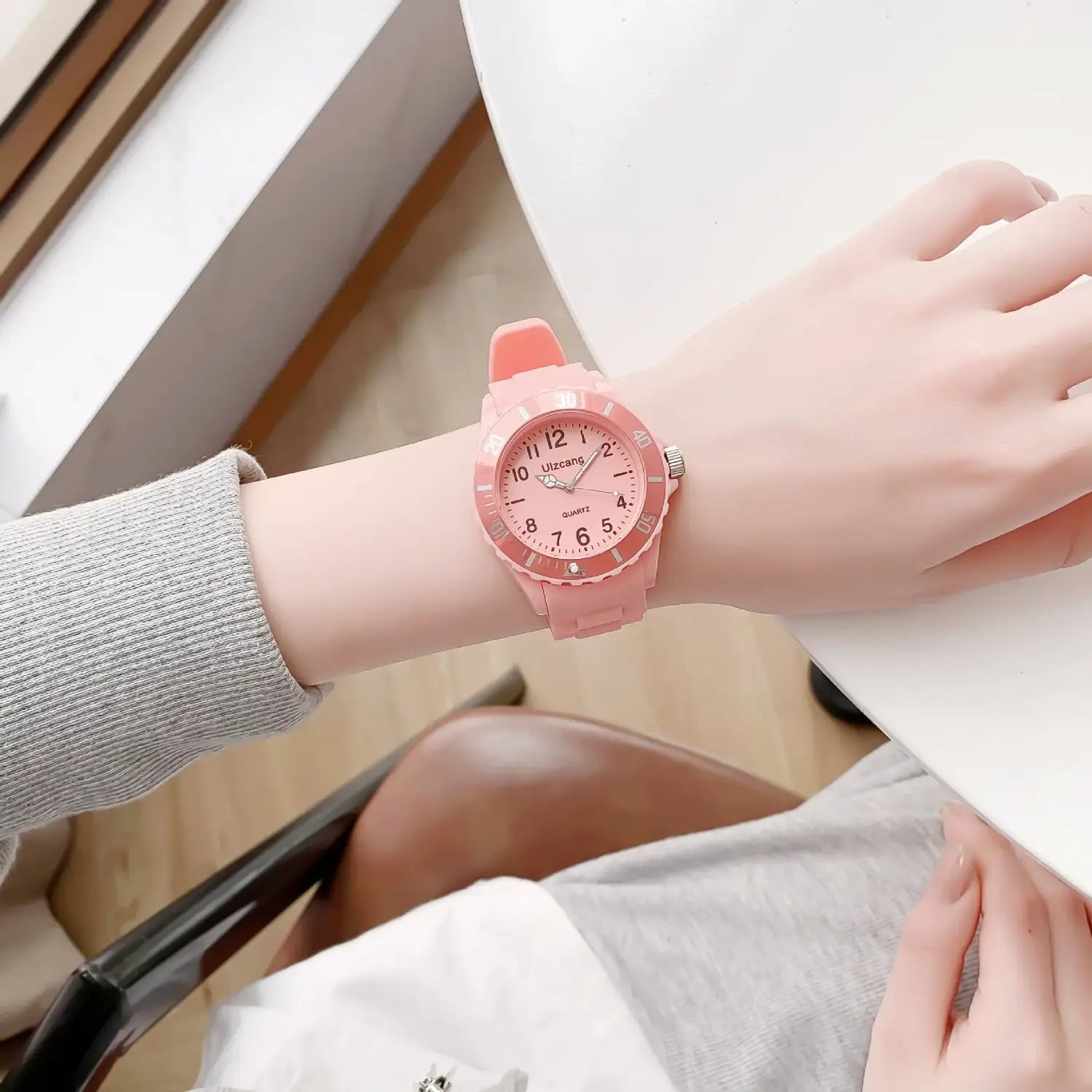 Pink silicone kids quartz watch with a matching pink dial and silver-tone hour markers designed as a colorful jelly wristwatch.