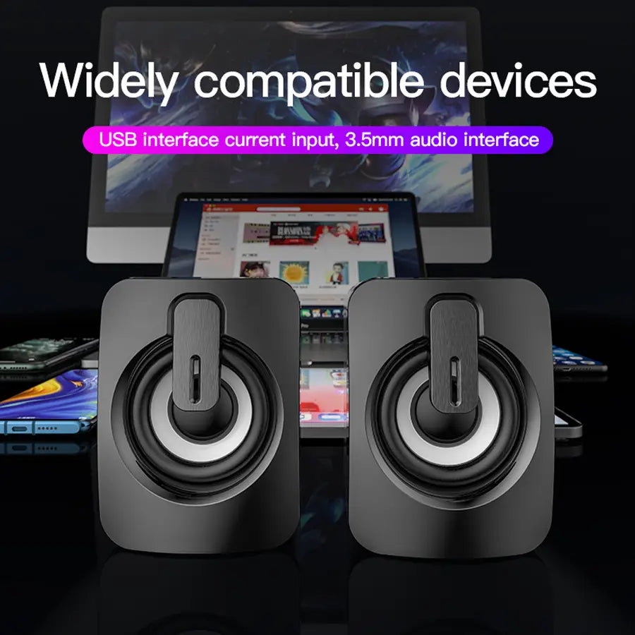 Schwarze rechteckige USB-Mini-Computermuslautsprecher mit silbernen Akzenten und einem zentralen Bedienknopf für die Verwendung in einem Stereo-Desktop-Audiosystem.