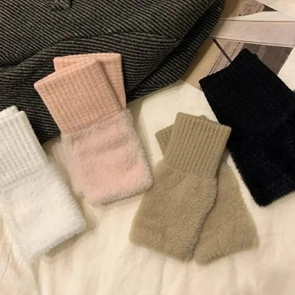 soft fluffy ankle socks in pastel pink and beige with ribbed cuffs complement fluffy fingerless knit gloves cream for cozy wear.