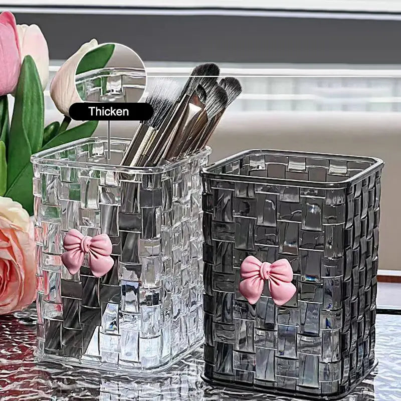 bow pen holder desktop storage organizer featuring clear and black woven glass brush holders each adorned with a pink bow