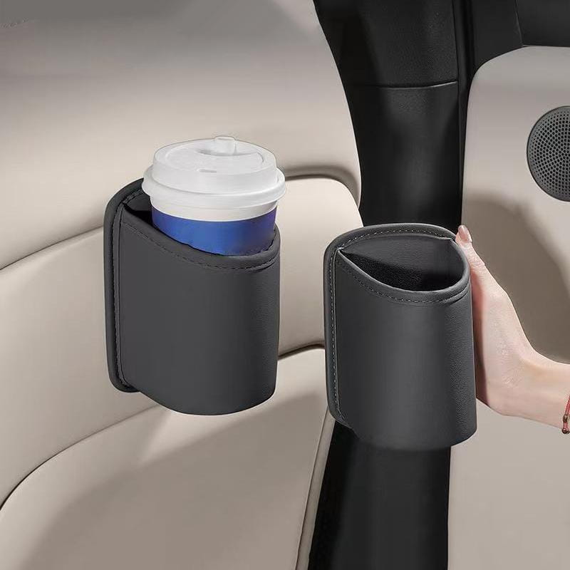 Manga de portavasos de cuero sintético color negro con abertura curvada y bordes cosidos para organizador de asiento de coche y portavasos.