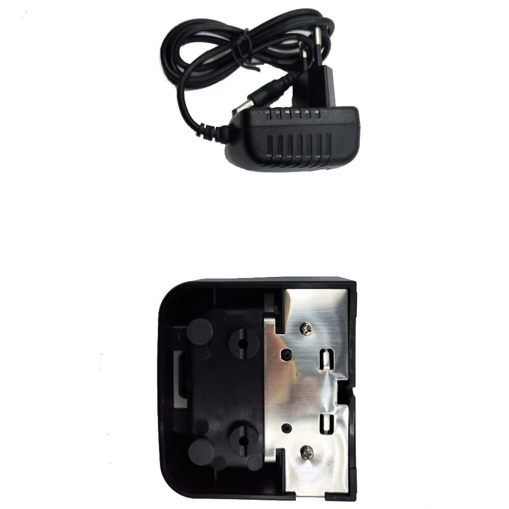 black plastic vhf marine radio ac adapter with coiled cord and european-style plug shown alongside matching black plastic housing with silver metal mounting plate for recent rs-38m charger