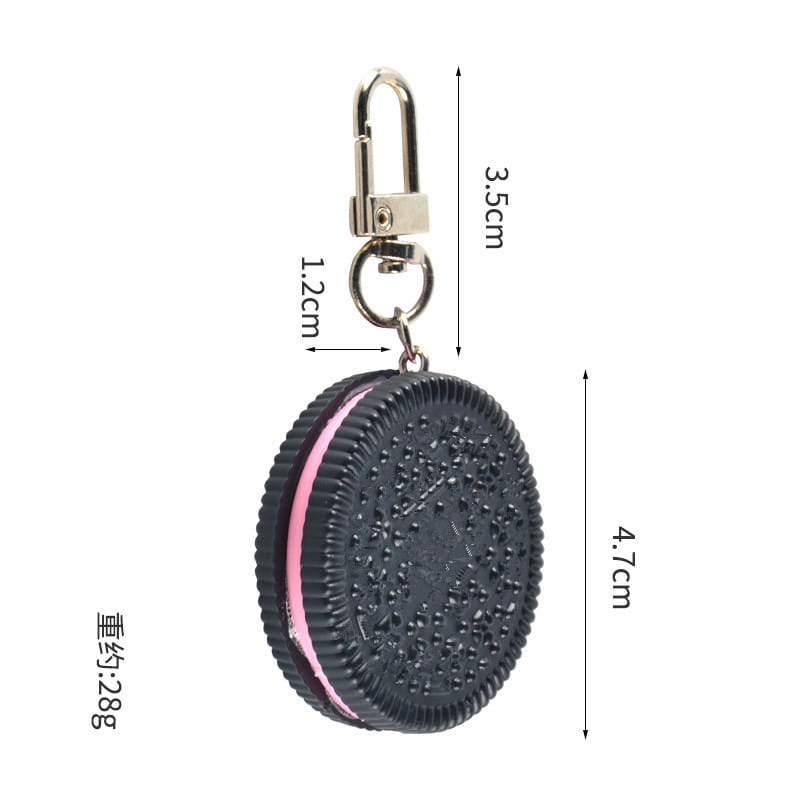 Chocolate biscuit cartoon key chain bag pendant featuring a black and pink oreo-themed keychain with a textured cookie design.