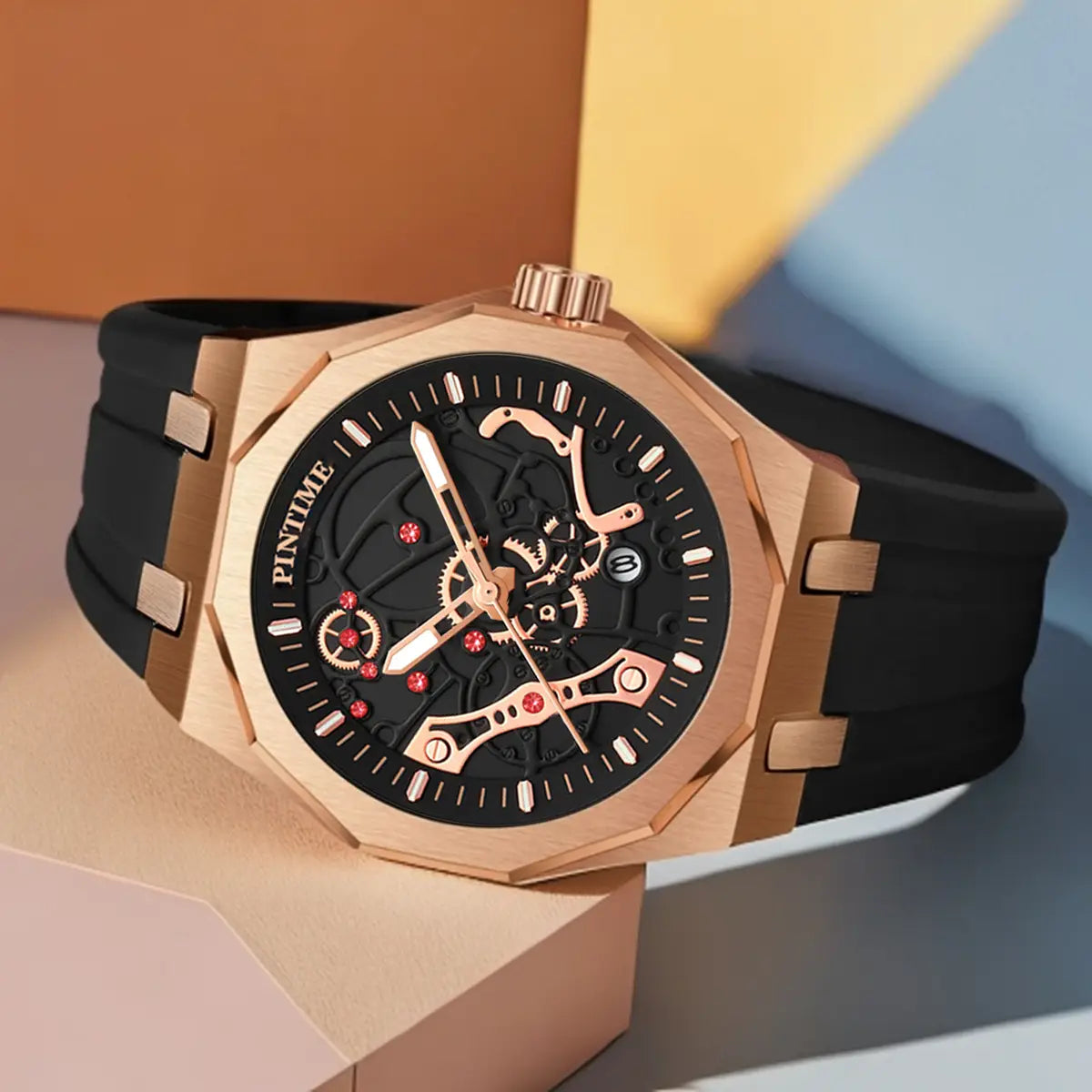 Pintime men luxury skeleton quartz watch featuring a rose gold case, black rubber strap, and red gemstone accents.