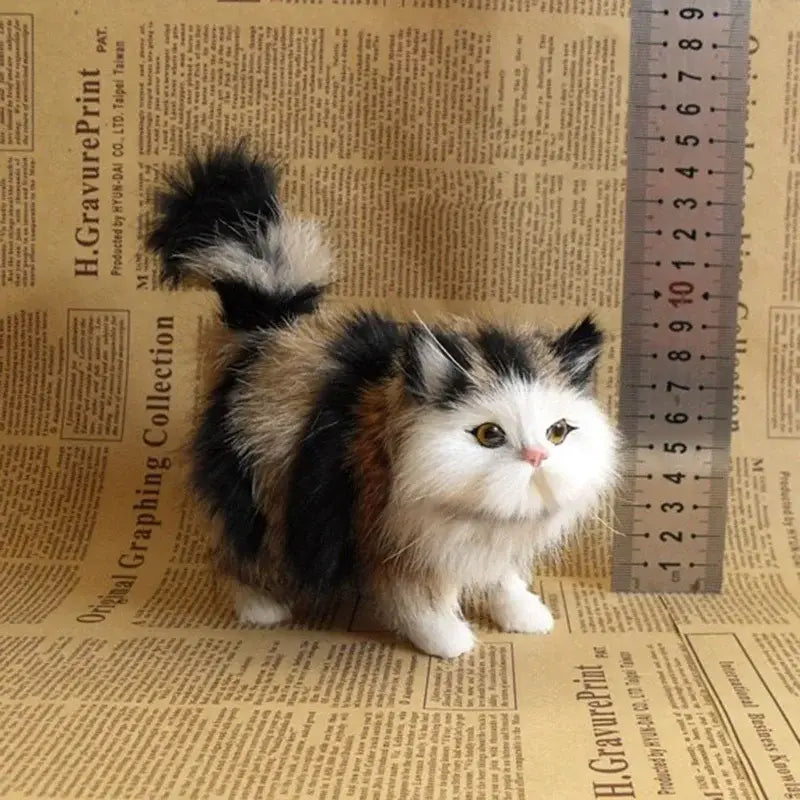 A plush tri-color calico simulation cat plush toy featuring soft black white and orange fur designed as a realistic stuffed animal.