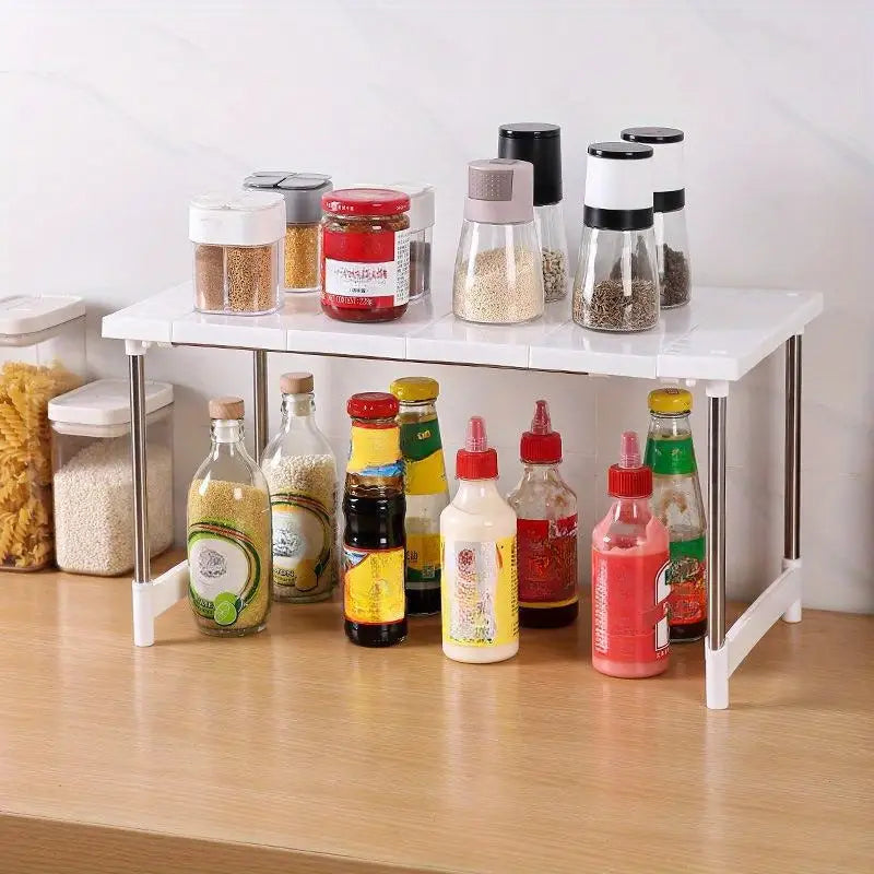 Étagère-organisateur de rangement pour étagère de cuisine à deux niveaux en plastique blanc, avec des pieds en acier inoxydable, servant de support de rangement pour l’organisation du comptoir de cuisine.