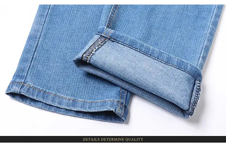 Men’s light-wash stretch cotton straight jeans with a rolled cuff and contrasting dark stitching designed as casual trousers.