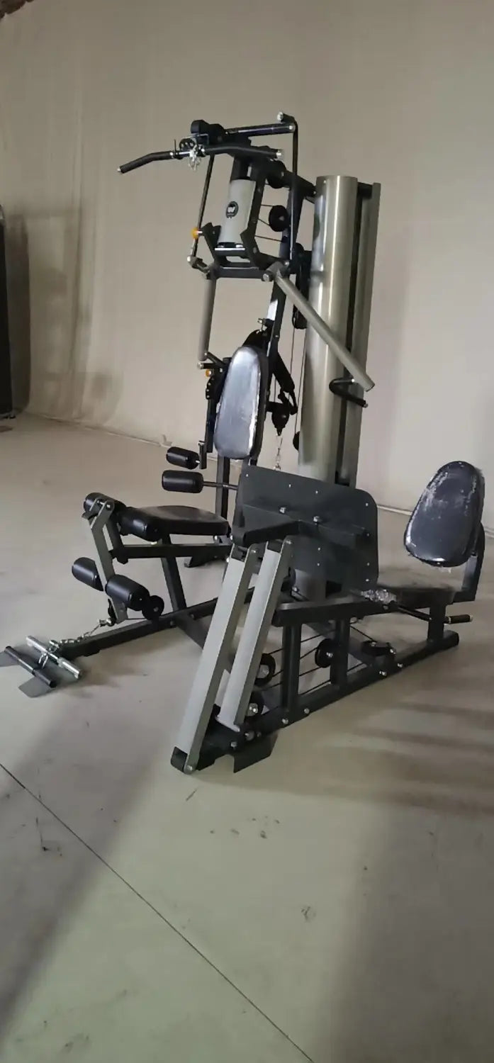 Black and silver 3-station multi-function home gym equipment with adjustable seating, weight stacks, and various exercise attachments for comprehensive strength training.