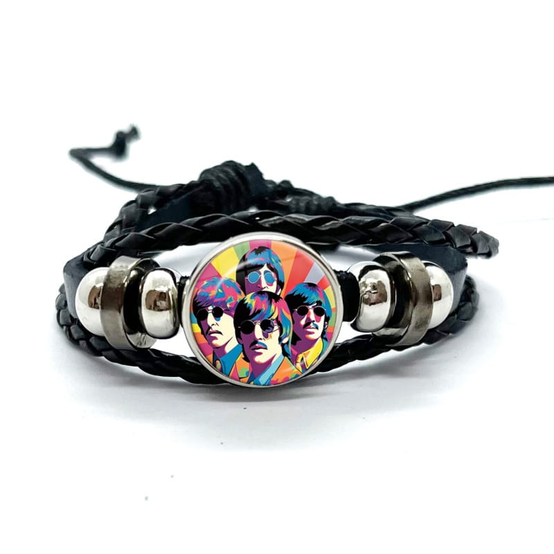Black braided leather bracelet featuring a colorful pop-art portrait of the Beatles in a circular glass dome charm with silver-toned metal beads.