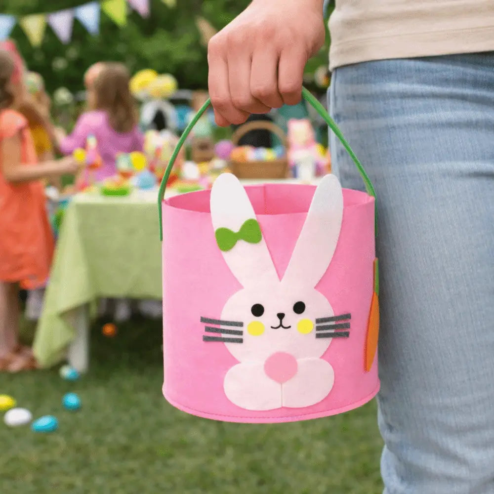 yellow felt Easter bunny basket gift bag featuring a pink felt body with green handle and embroidered details