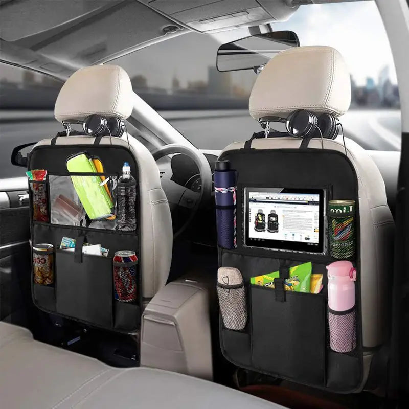 black car backseat organizer with multiple pockets and central tablet holder showing the back side holding drinks snacks headphones and an ipad