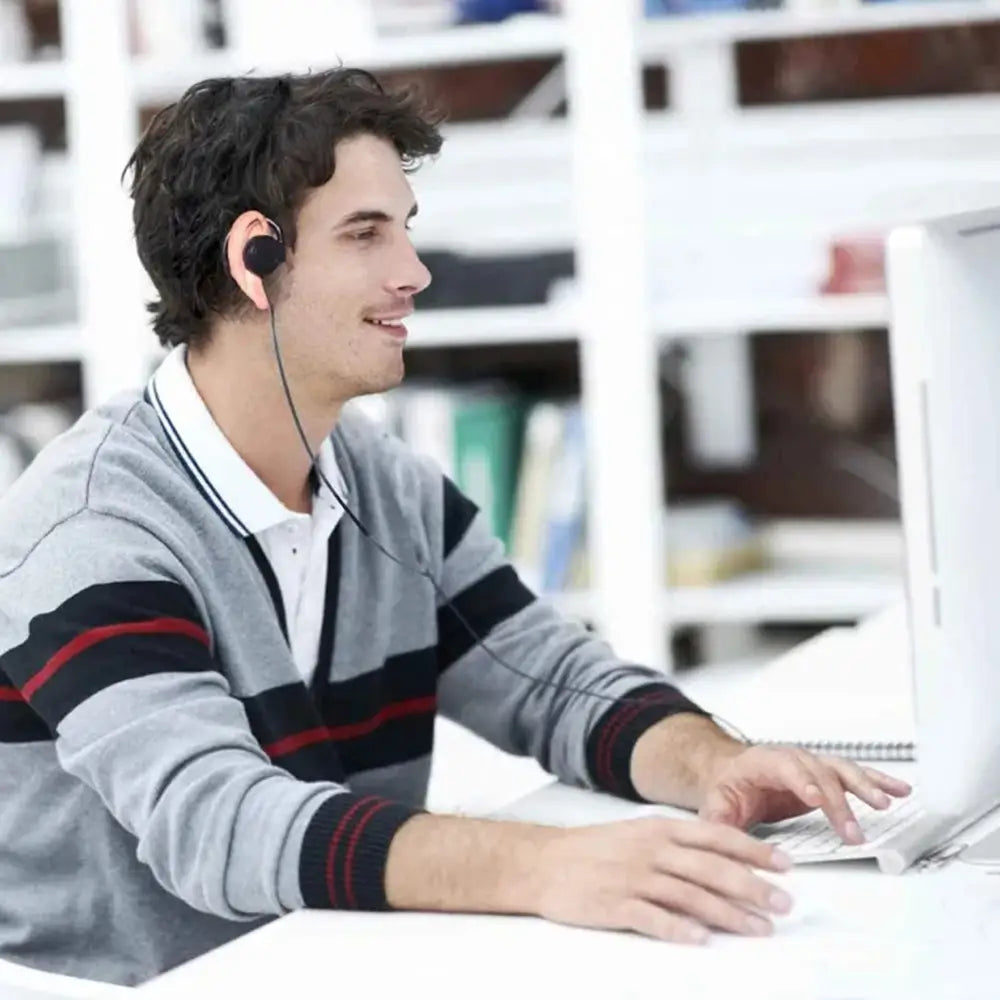 Black over-ear single ear hook 3.5mm wired headphone with thin wire and comfortable earpiece designed for extended use.
