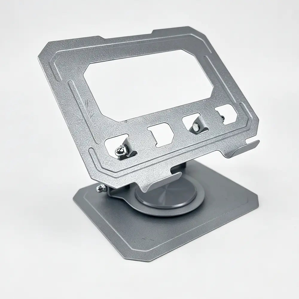 Silver metallic tablet stand with sleek angular design and adjustable clamp mechanism featuring stepless height adjustment and 360 rotating capability.