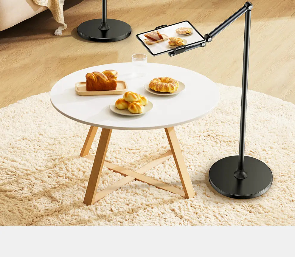black adjustable tablet stand with a sleek articulated arm and circular base made of aluminum alloy for tablet and phone floor use