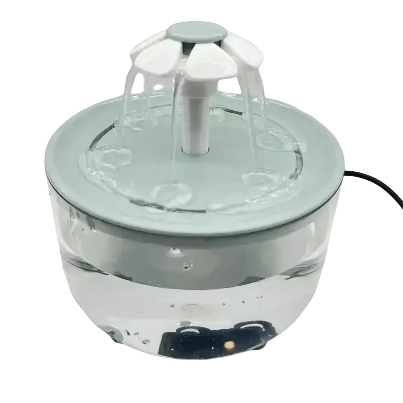 A sleek light blue pet water fountain with a white flower-shaped spout and clear glass base front view water dispenser
