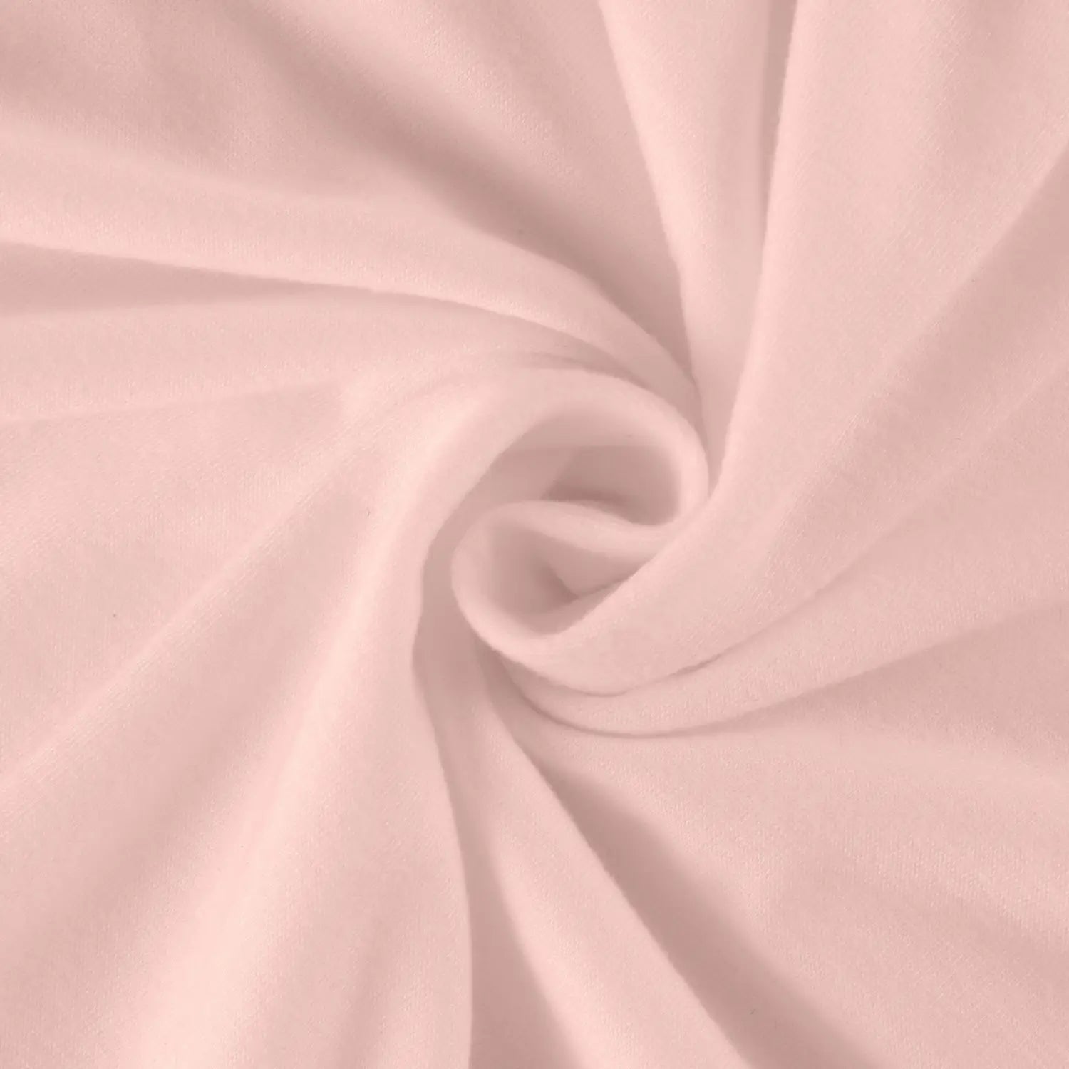Soft blush pink long sleeve cotton tunic top with a smooth slightly textured surface and no visible pattern type.