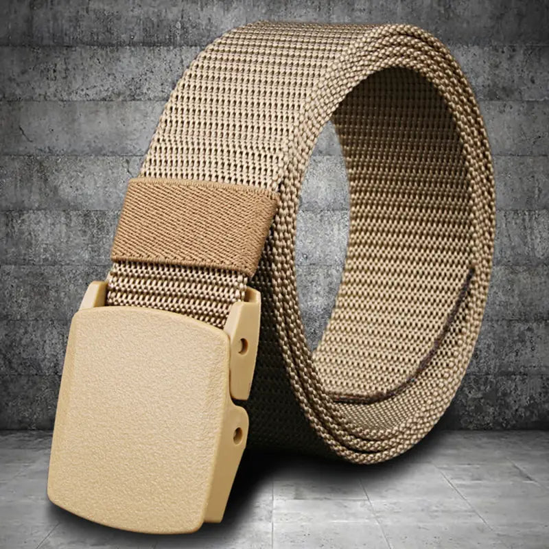 Tan tactical canvas webbing belt with a lightweight automatic plastic buckle for men